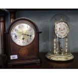 Mantle clock together with a glass cased clock