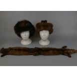 2 fur hats together with a fur scarf