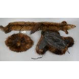 2 fur hats together with a fur scarf