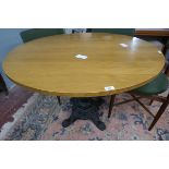 Round beech kitchen table with cast iron base