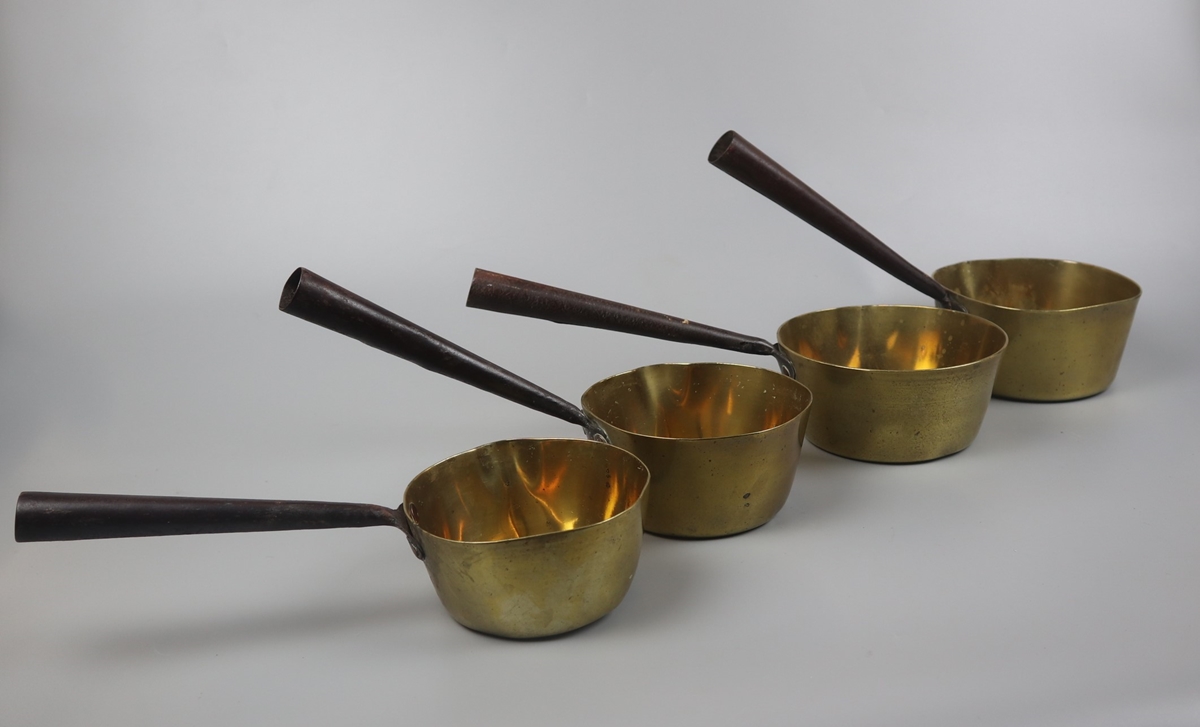 Set of 4 heavy brass saucepans