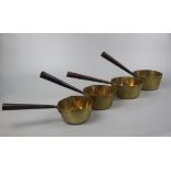 Set of 4 heavy brass saucepans