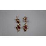 Pair of ruby and diamond gold set earrings