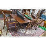 Mahogany extending dining table with set of 8 Chippendale style chairs