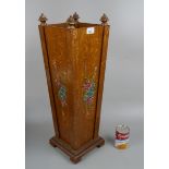 Fine hand painted stick stand adorned with pineapple finials