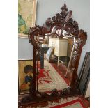 Ornate mahogany framed mirror