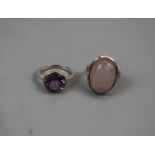 Silver amethyst set ring together with a silver rose quartz set ring