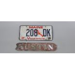 Early Austin badge together with American number plate
