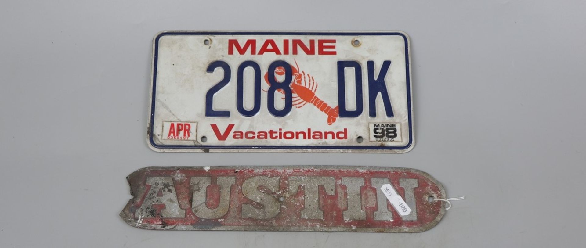 Early Austin badge together with American number plate