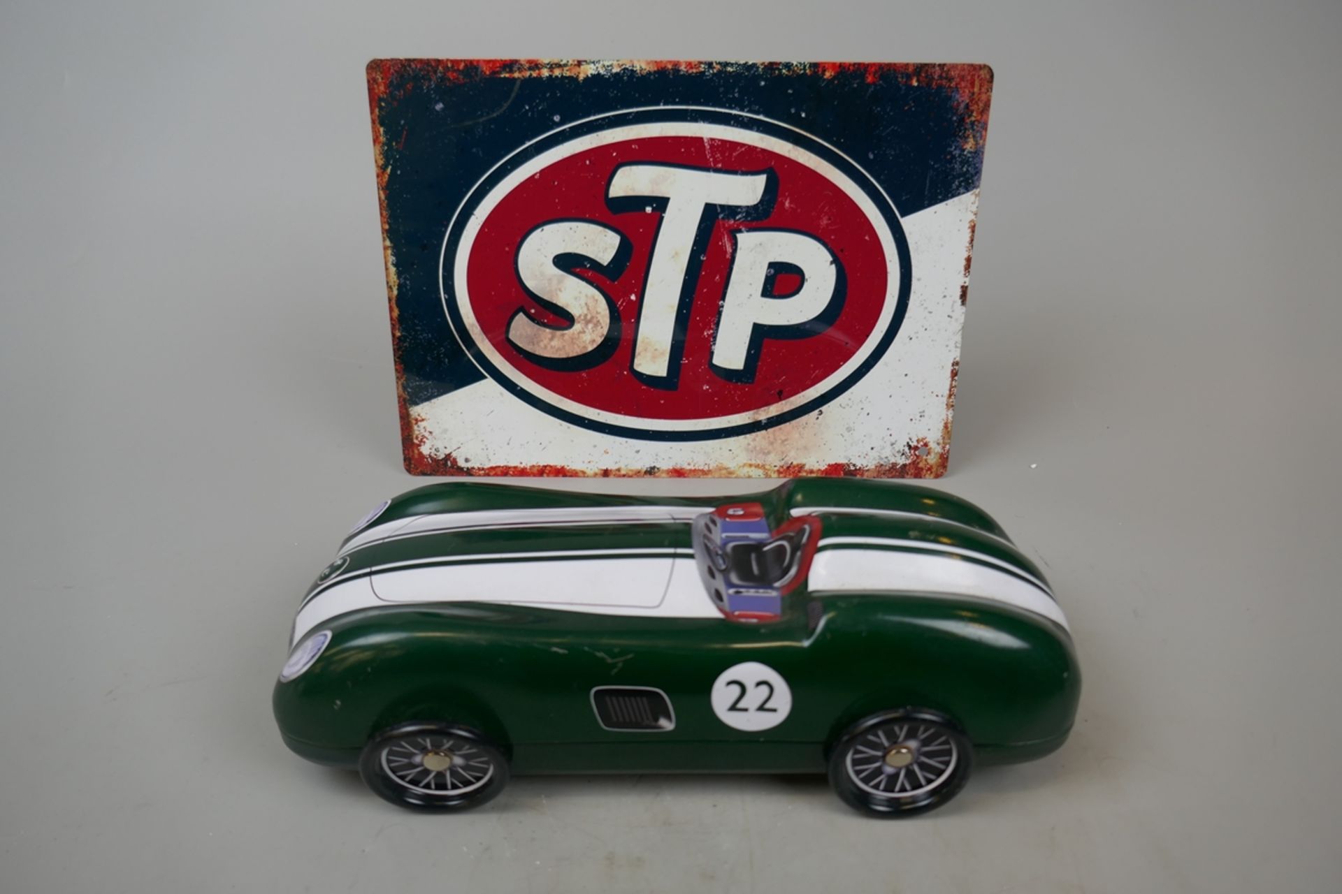 STP sign together with a model car