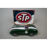 STP sign together with a model car