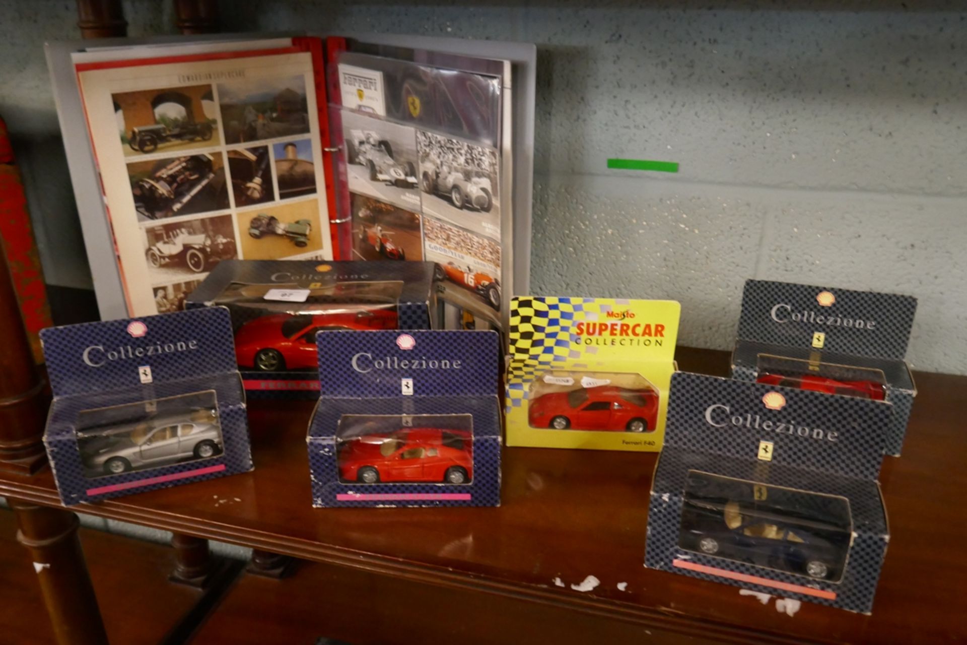 Collection of Ferrari models in original boxes together with folder