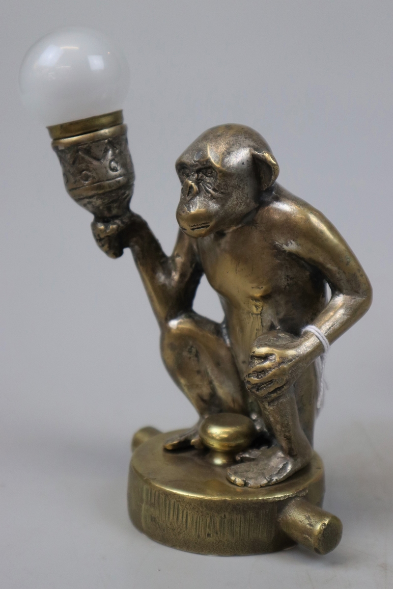 Brass car mascot radiator cap - Monkey holding a light