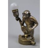 Brass car mascot radiator cap - Monkey holding a light