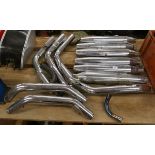 Collection of Harley Davidson exhaust pipes and cans