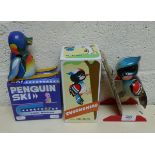 Wind up tin plate toy penguin and woodpecker