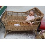 Wicker cot along with doll