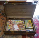 Vintage travel trunk full of vintage jigsaws