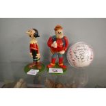 Figures of Desperate Dan & Olive Oil together with a baseball with printed signatures