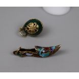 Enamelled shoe charm with possibly Russian marks together with small green egg charm