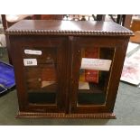 Edwardian glazed oak smokers cabinet with contents