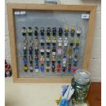 Framed Lego style figures together with approx 175 marbles