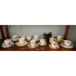 Collection of tea cups & saucers together with a creamer