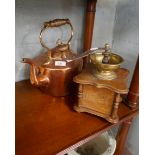 Antique coffee grinder together with a copper kettle