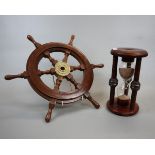 Large egg timer together with a mini ships wheel