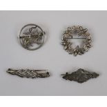 4 silver brooches