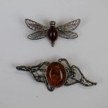 2 amber set silver brooches