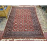 Large red patterned rug - Approx size: 162cm x 264cm