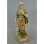 Royal Dux porcelain figure of a classically dressed maiden. Late 19th C - Approx height: 40cm