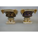 Pair of Derby late 19thC open handled urns with gilt decoration