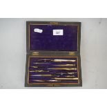 Mahogany and brass box together with an oak technical drawing cased set