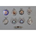 Collection of gold & silver fobs and badges