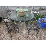 Wrought iron circular garden table with 4 chairs