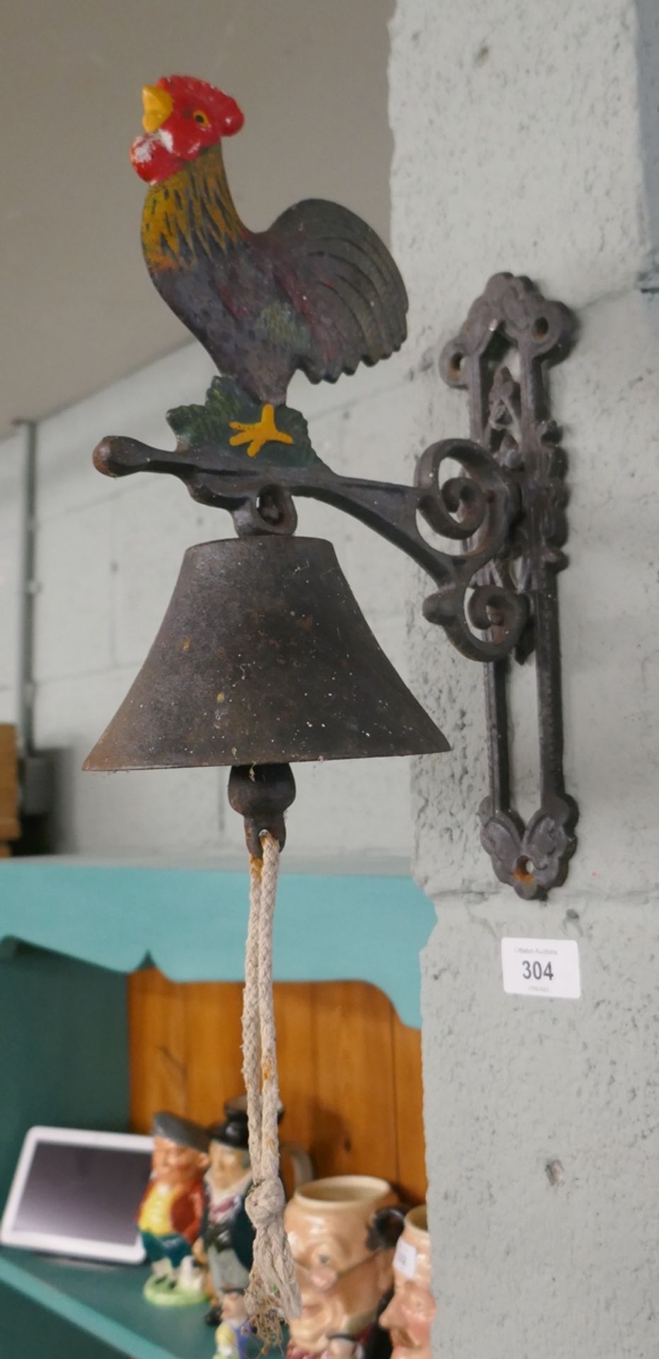 Cast iron bell in the form of a cockerel