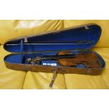 Antique violin with lions head in case