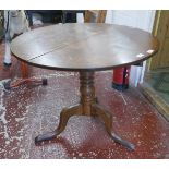 Round oak tilt top tripod table