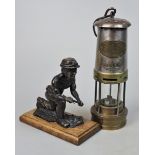 Miners lamp together with a miner figurine