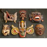 Collection of hand painted carved facemasksÿ