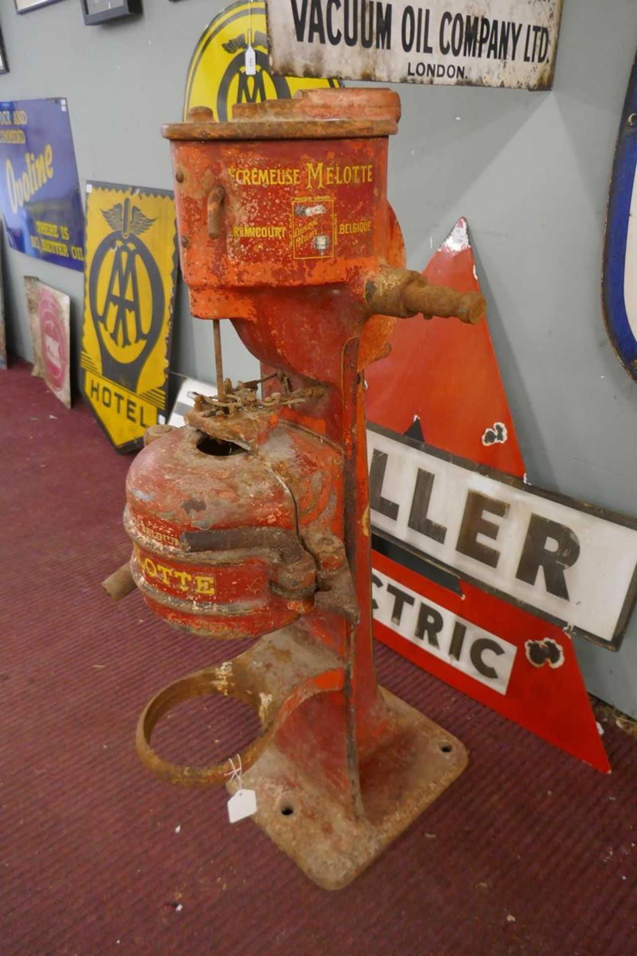 Heavy, red painted machine/pump part marked Mellote Belgique - Approx height: 95cm