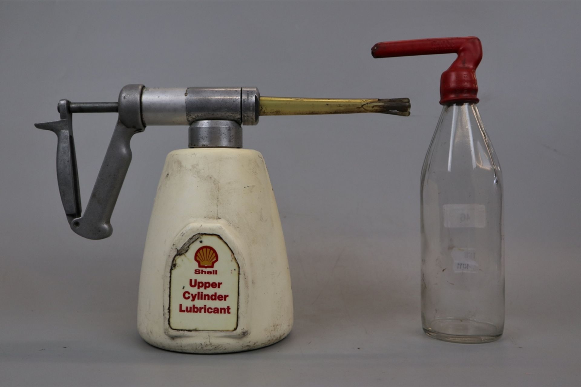 Vintage Shell upper cylinder lubricant can together with Exide battery filling bottle