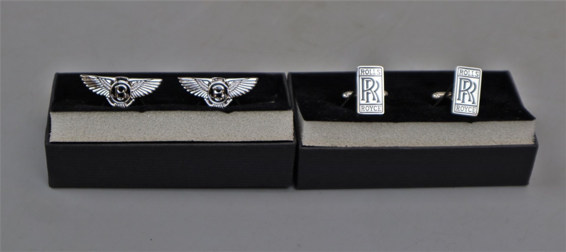 Pair of Rolls Royce cufflinks together with a pair of Bentley ones