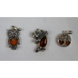 3 silver & amber pendants