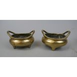 Pair of antique Chinese polished bronze 2 handled tripod censors with Xuande 16 character mark