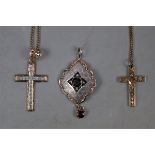 2 9ct gold crucifix and chains together with silver and garnet pendant approx gross weight of gold