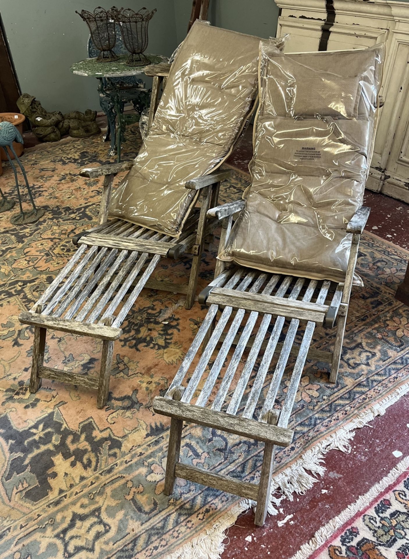 2 teak steamer chairs with new cushions