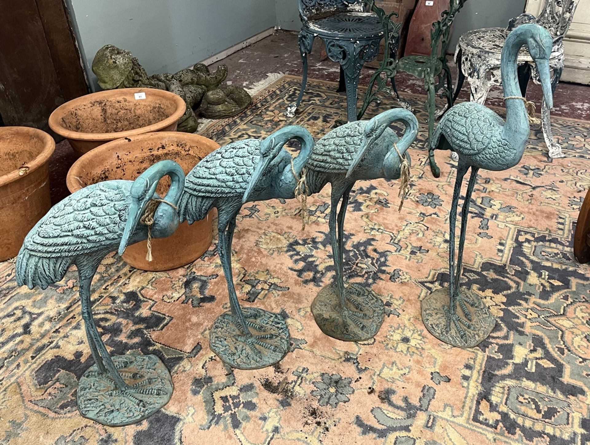 4 metal crane figures with verdigris patina - Approx height of tallest: 77cm